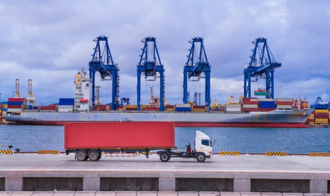 a truck leaves the port after loading completely