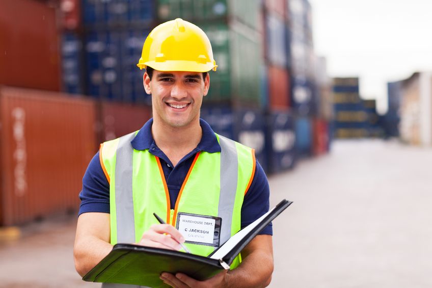 fsma worker at a seaport checking containers for safety