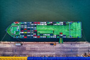 roro ship packed with cars by a seaport