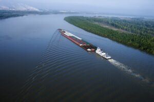Cargo carrying barge exporting goods out the Mississippi River.