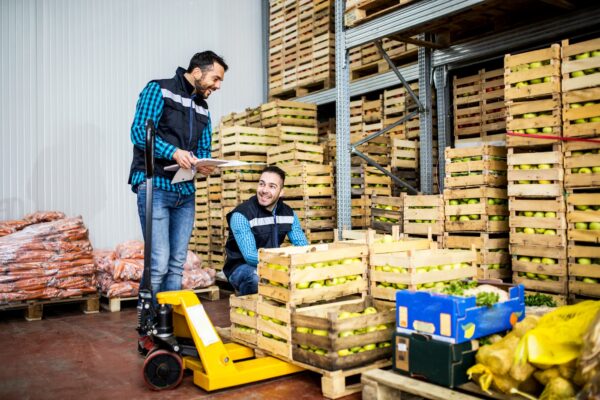warehouse operators selecting crates to load cargo unto.