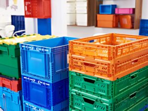colorful plastic crates used in warehouses